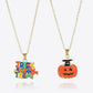 Two gold-tone necklaces, one with a colorful "Trick or Treat" pendant and one with a jack-o'-lantern.