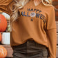 A woman wears a brown long-sleeve top with "Happy Halloween" text and a spiderweb graphic.