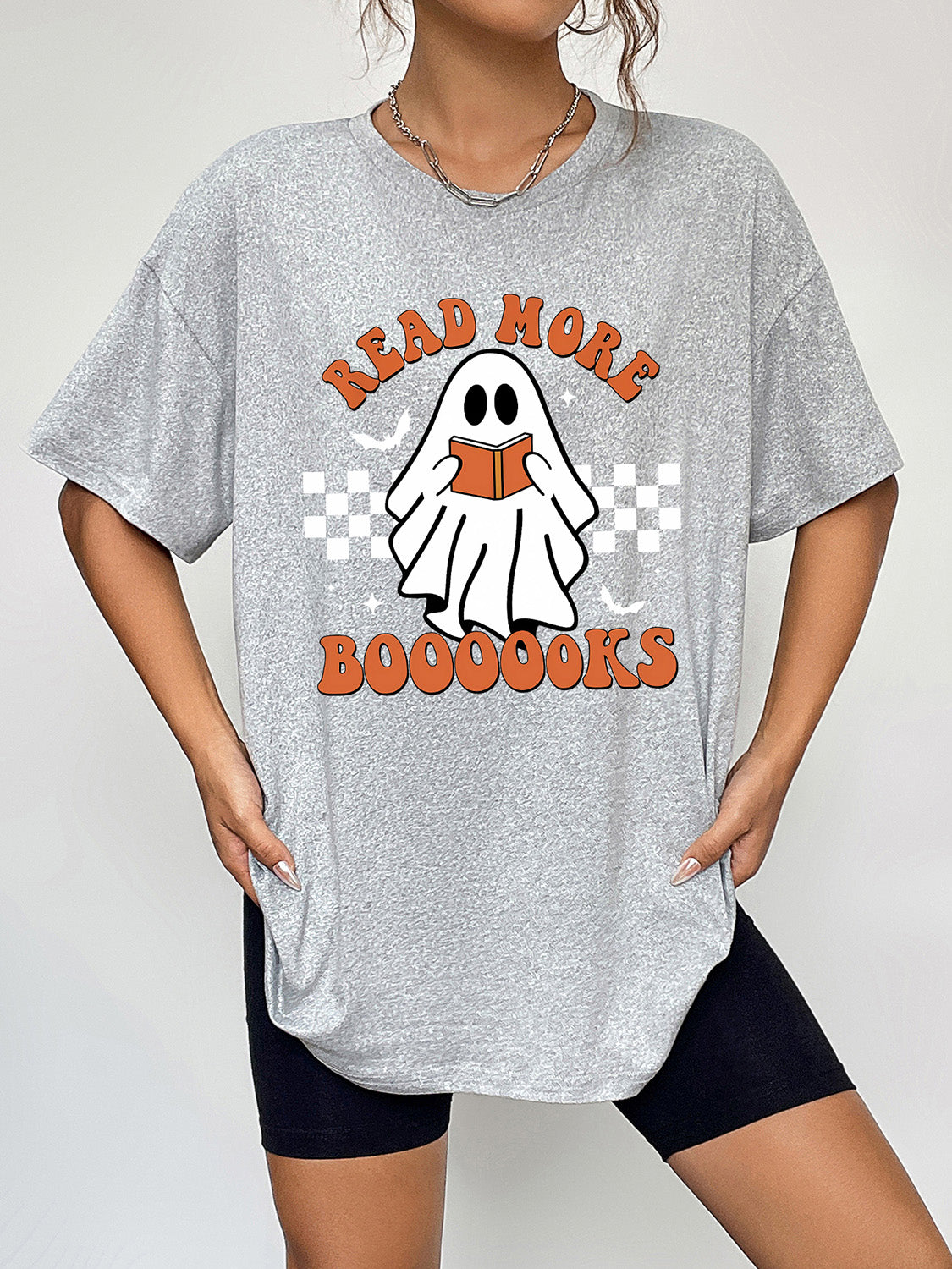 Gray short-sleeve t-shirt with a ghost graphic reading "Read More Boooooks."