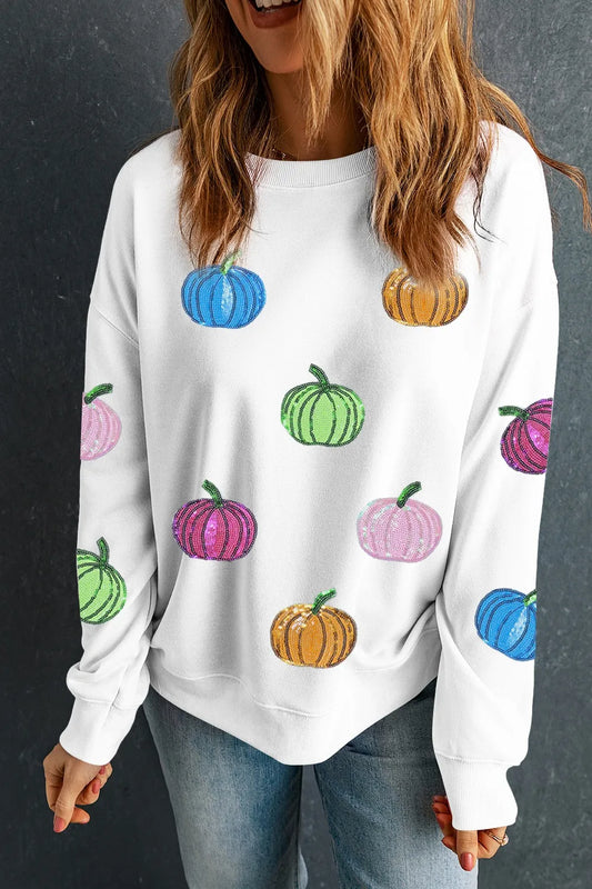 White long-sleeve sweatshirt with colorful sequin pumpkins.