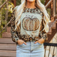Leopard print long sleeve sweatshirt with a pumpkin graphic.