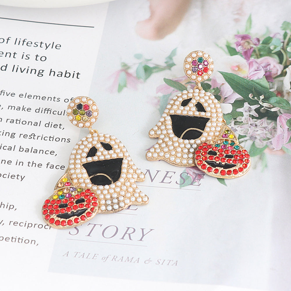 Ghost-shaped alloy earrings with rhinestone accents and a pumpkin charm.