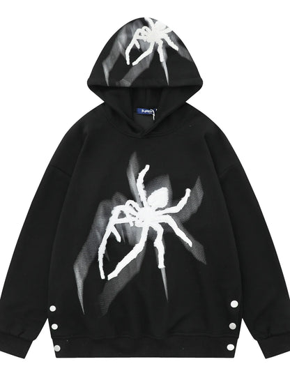 Men's black oversized hoodie with a white spider graphic and side button details.