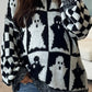 Black and white ghost and checkerboard pattern dropped shoulder long sleeve sweater.