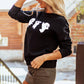 Black long-sleeve sweatshirt with three white ghost graphics.