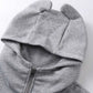 Gray zip-up hoodie with devil horns on the hood.