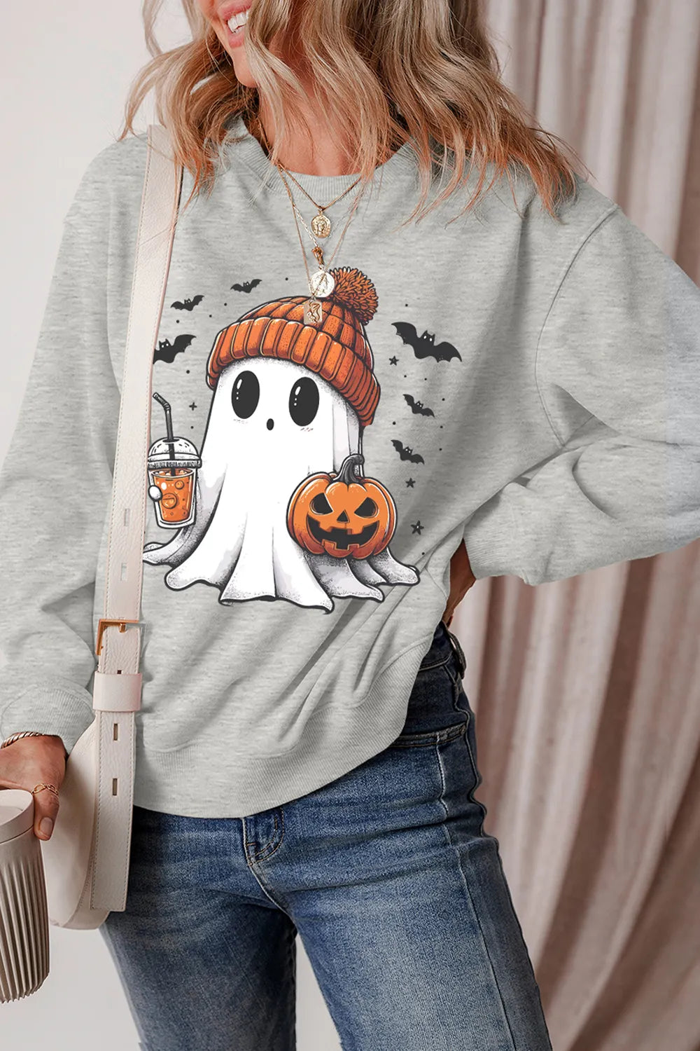 Ghost Round Neck Long Sleeve Sweatshirt with a ghost, pumpkin, and bats graphic.