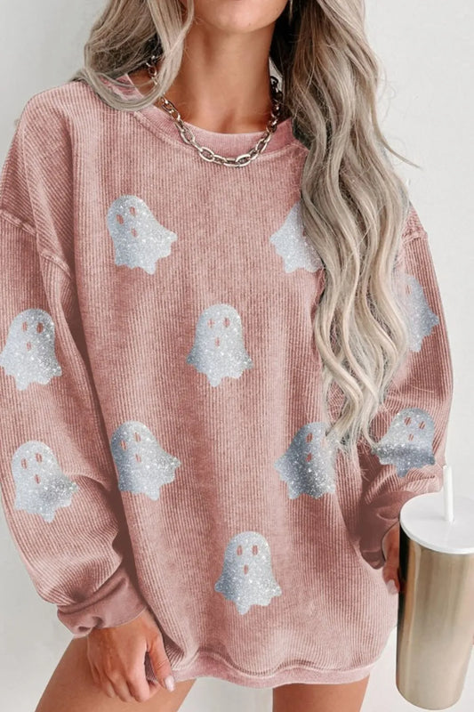 Oversized pink corduroy sweatshirt with glitter ghost graphics.