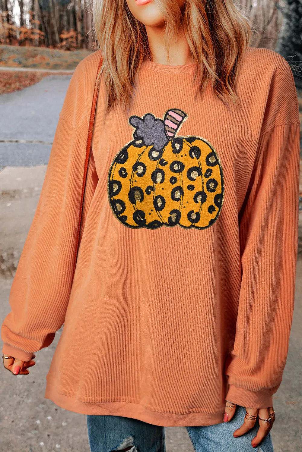 Pumpkin Round Neck Long Sleeve Sweatshirt with a leopard print pumpkin design.