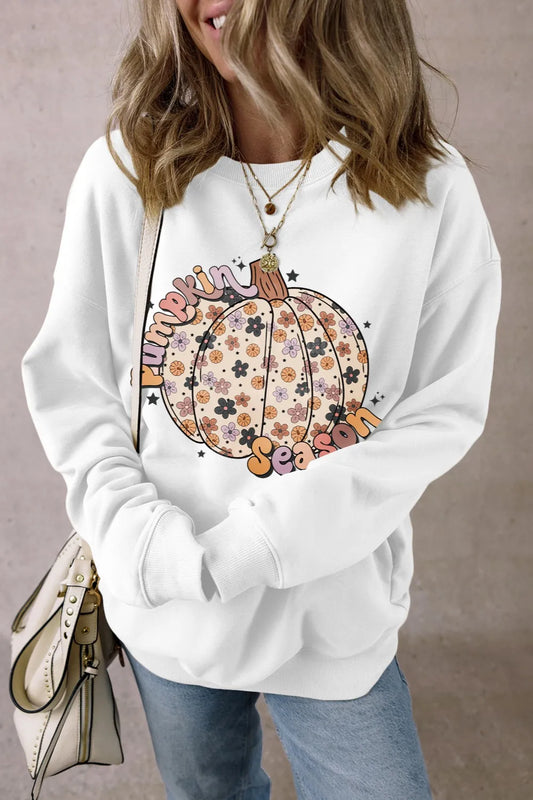 White long sleeve sweatshirt with a floral pumpkin graphic.