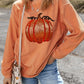 Orange sequin pumpkin long sleeve sweatshirt.