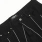 Black jeans with a "11KN BRAND UNISEX" label and silver chain details.